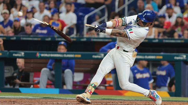 Mar 16, 2026; Miami, FL, United States; Italy third baseman Andrew Fischer (11) hits a broken bat single in the fourth inning against Venezuela during a semifinal game of the 2026 World Baseball Classic at loanDepot Park. Mandatory Credit: Sam Navarro-Imagn Images Mar 16, 2026; Miami, FL, United States; Italy third baseman Andrew Fischer (11) hits a broken bat single in the fourth inning against Venezuela during a semifinal game of the 2026 World Baseball Classic at loanDepot Park. Mandatory Credit: Sam Navarro-Imagn Images
