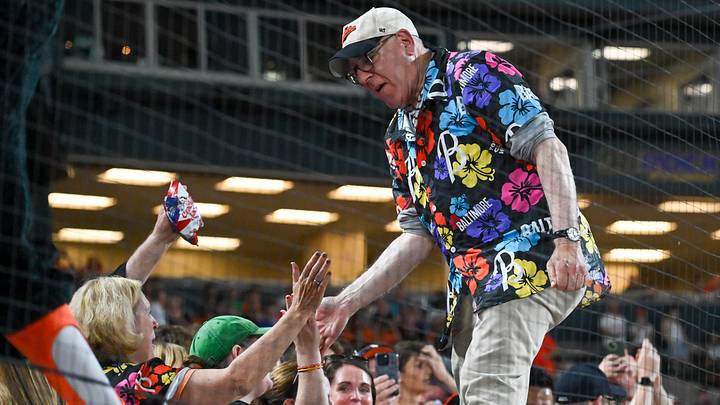 Jun 29, 2024; Baltimore, Maryland, USA; Baltimore Orioles owner David Rubenstein high fives fans during the seventh inning stretch against the Texas Rangers at Oriole Park at Camden Yards. Mandatory Credit: Tommy Gilligan-USA TODAY Sports Jun 29, 2024; Baltimore, Maryland, USA; Baltimore Orioles owner David Rubenstein high fives fans during the seventh inning stretch against the Texas Rangers at Oriole Park at Camden Yards. Mandatory Credit: Tommy Gilligan-USA TODAY Sports