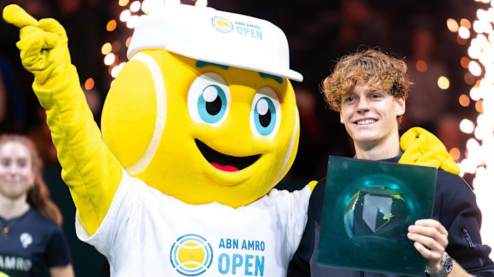 Jannik Sinner is seen posing with his trophy and the mascot after winning the tournament during Day 7 of the ABN AMRO Open 2024 at Ahoy on February 18, 2024 in Rotterdam, Netherlands. 