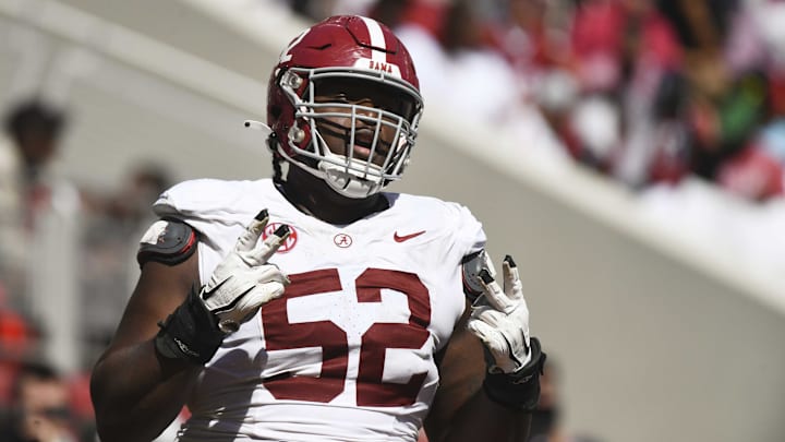 Apr 13, 2024; Tuscaloosa, AL, USA;  Alabama offensive lineman Tyler Booker (52) celebrates after the offense scored a touchdown during the A-Day scrimmage at Bryant-Denny Stadium. Mandatory Credit: Gary Cosby Jr.-Imagn Images