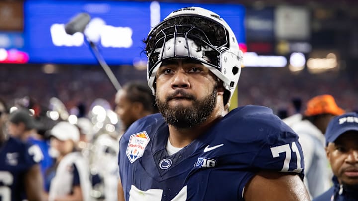 Dec 31, 2024; Glendale, AZ, USA; Penn State Nittany Lions offensive lineman Olaivavega Ioane (71) against the Boise State Broncos during the Fiesta Bowl at State Farm Stadium. Mandatory Credit: Mark J. Rebilas-Imagn Images