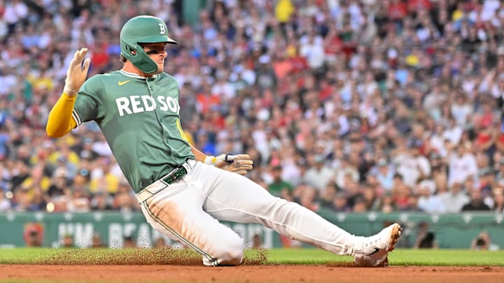 Aug 1, 2025; Boston, Massachusetts, USA; Boston Red Sox left fielder Roman Anthony (19) slides into third base during the third inning against the Houston Astros at Fenway Park. Mandatory Credit: Eric Canha-Imagn Images