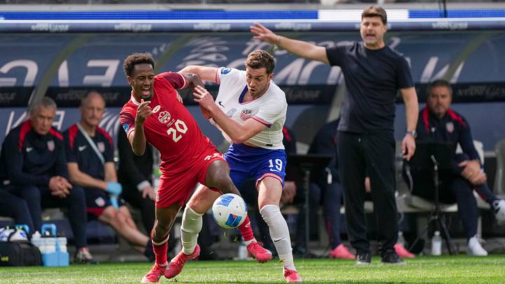 Mauricio Pochettino watches Joe Scally battle with Ali Ahmed during the USMNT's loss to Canada in the 2025 Nations League. Mauricio Pochettino watches Joe Scally battle with Ali Ahmed during the USMNT's loss to Canada in the 2025 Nations League.