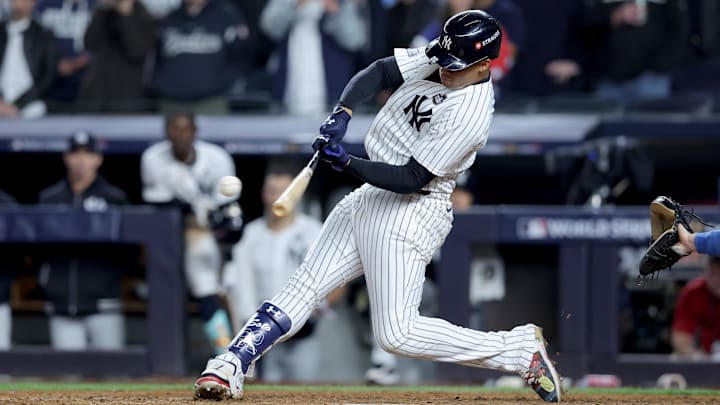Oct 29, 2024; New York, New York, USA; New York Yankees outfielder Juan Soto (22) doubles during the eighth inning against the Los Angeles Dodgers in game four of the 2024 MLB World Series at Yankee Stadium. Mandatory Credit: Brad Penner-Imagn Images