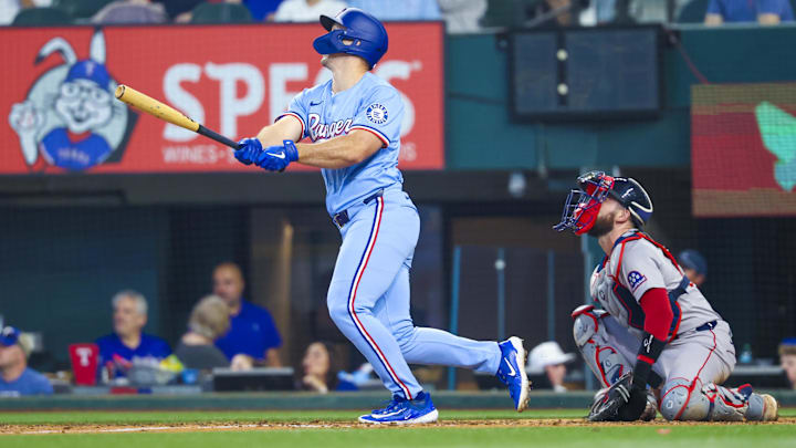 Mar 30, 2025; Arlington, Texas, USA; Texas Rangers left fielder Wyatt Langford (36) hits a home run during the sixth inning against the Boston Red Sox at Globe Life Field.