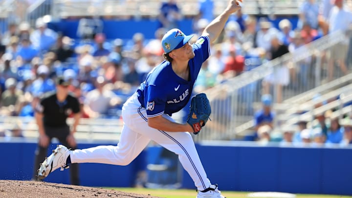 Feb 21, 2026; Dunedin, Florida, USA; Toronto Blue Jays pitcher Adam MacKo (64) throws a pitch during the third inning against the Philadelphia Phillies  at TD Ballpark. Mandatory Credit: Kim Klement Neitzel-Imagn Images