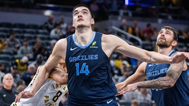 Memphis Grizzlies center Zach Edey (14) boxes out Indiana Pacers forward Enrique Freeman 