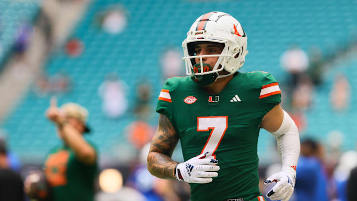 Nov 2, 2024; Miami Gardens, Florida, USA; Miami Hurricanes wide receiver Xavier Restrepo (7) runs on the field before the game against the Duke Blue Devils at Hard Rock Stadium. Mandatory Credit: Sam Navarro-Imagn Images