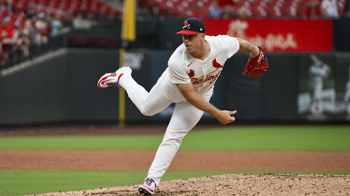 Jul 13, 2025; St. Louis, Missouri, USA;  St. Louis Cardinals relief pitcher Ryan Helsley (56) pitches against the Atlanta Braves during the ninth inning at Busch Stadium. Mandatory Credit: Jeff Curry-Imagn Images