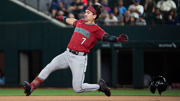 May 11, 2026; Arlington, Texas, USA;  Arizona Diamondbacks right fielder Corbin Carroll (7) slides into second base with a double against the Texas Rangers during the first inning at Globe Life Field. Mandatory Credit: Raymond Carlin III-Imagn Images