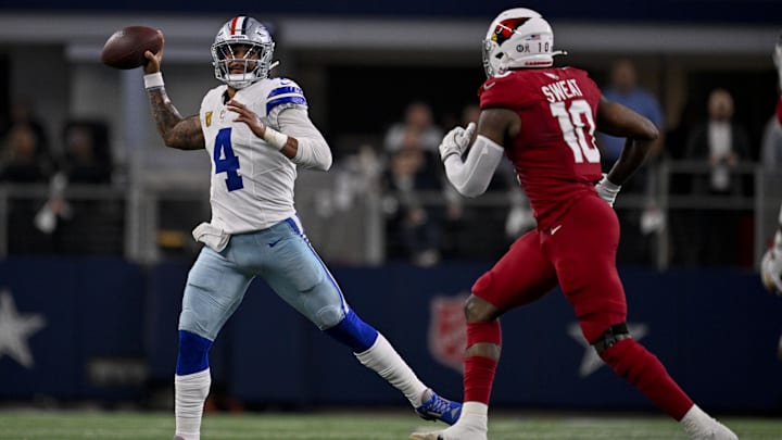 Dallas Cowboys quarterback Dak Prescott throws the ball over Arizona Cardinals linebacker Josh Sweat.