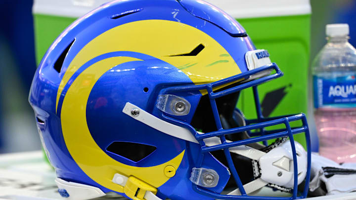 Nov 17, 2024; Foxborough, Massachusetts, USA; A Los Angeles Rams helmet sits on a cooler during the second half against the New England Patriots at Gillette Stadium. Mandatory Credit: Eric Canha-Imagn Images
