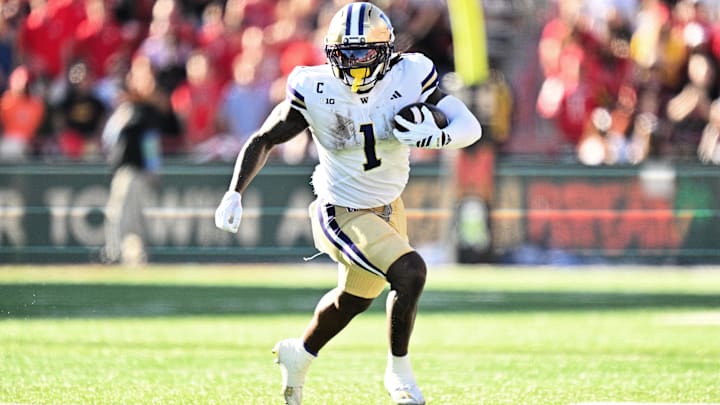 Oct 4, 2025; College Park, Maryland, USA;  Washington Huskies running back Jonah Coleman (1) carries the ball against the Maryland Terrapins at SECU Stadium. Mandatory Credit: Jamie Sabau-Imagn Images