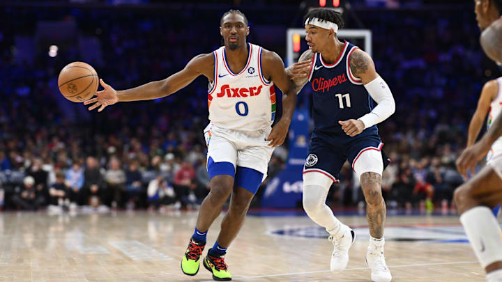 Nov 24, 2024; Philadelphia, Pennsylvania, USA; Philadelphia 76ers guard Tyrese Maxey (0) passes the ball against Los Angeles Clippers guard Jordan Miller (11) in the first quarter at Wells Fargo Center. Mandatory Credit: Kyle Ross-Imagn Images