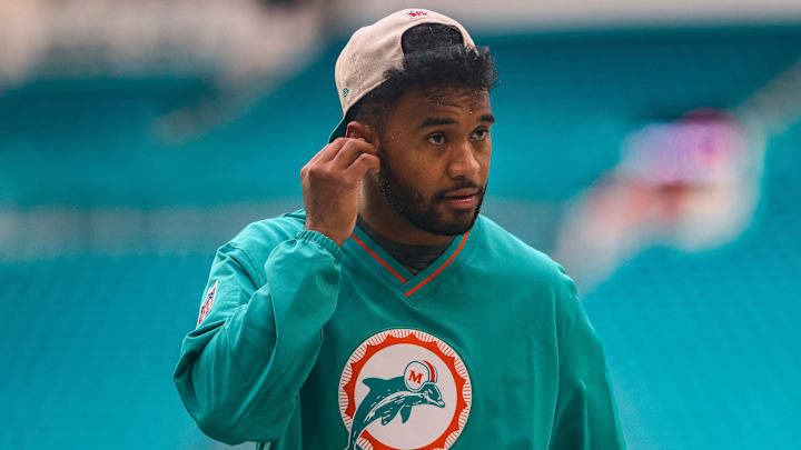 Sep 12, 2024; Miami Gardens, Florida, USA; Miami Dolphins quarterback Tua Tagovailoa (1) walks on the field before a game against the Buffalo Bills at Hard Rock Stadium. Mandatory Credit: Sam Navarro-Imagn Images