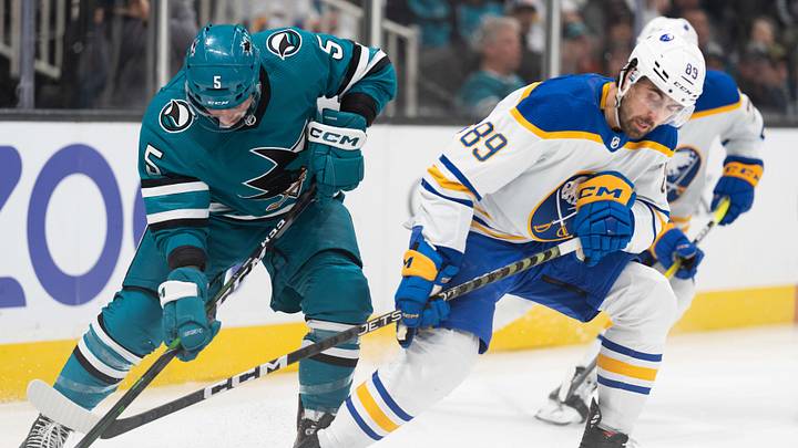 Feb 18, 2023; San Jose, California, USA; San Jose Sharks defenseman Matt Benning (5) and Buffalo Sabres right wing Alex Tuch (89) attempt to gain control of the puck during the first period at SAP Center at San Jose. Mandatory Credit: Stan Szeto-Imagn Images Feb 18, 2023; San Jose, California, USA; San Jose Sharks defenseman Matt Benning (5) and Buffalo Sabres right wing Alex Tuch (89) attempt to gain control of the puck during the first period at SAP Center at San Jose. Mandatory Credit: Stan Szeto-Imagn Images