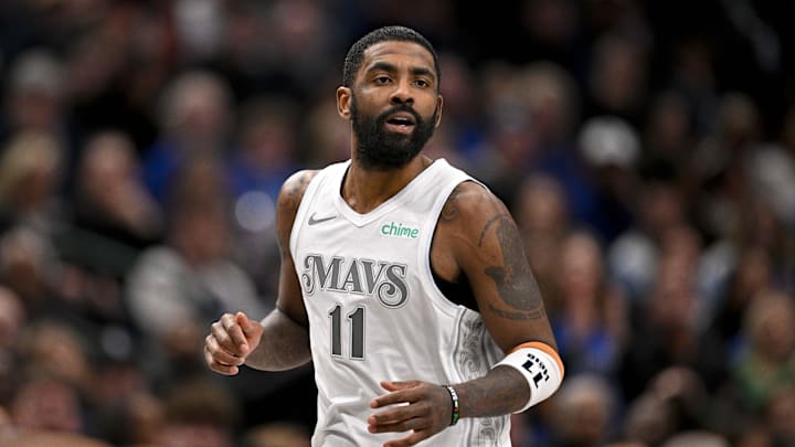 Jan 22, 2025; Dallas, Texas, USA; Dallas Mavericks guard Kyrie Irving (11) runs back up the court during the second half against the Minnesota Timberwolves at the American Airlines Center. Mandatory Credit: Jerome Miron-Imagn Images