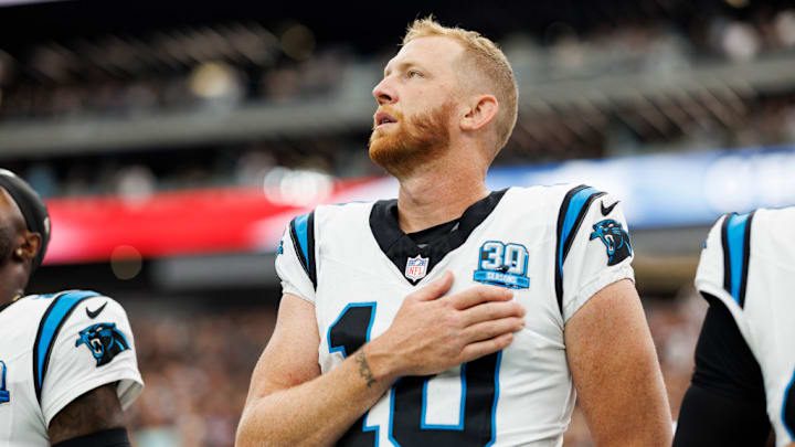 LAS VEGAS, NEVADA - SEPTEMBER 22: Punter Johnny Hekker #10 of the Carolina Panthers stands on the sidelines during the national anthem prior to an NFL football game against the Las Vegas Raiders, at Allegiant Stadium on September 22, 2024 in Las Vegas, Nevada.