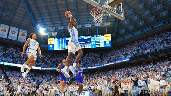 Nov 7, 2025; Chapel Hill, North Carolina, USA; North Carolina Tar Heels forward Caleb Wilson (8) dunks the ball as guard Seth Trimble (7) is in the background near the end of the second half at Dean E. Smith Center. Mandatory Credit: Bob Donnan-Imagn Images