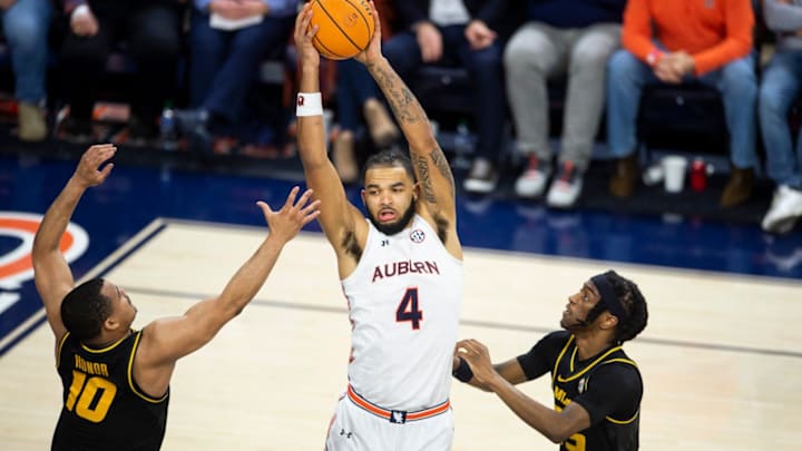 Auburn Tigers forward Johni Broome (4) grabs a rebound as Auburn Tigers take on Missouri Tigers at Neville Arena in Auburn, Ala., on Tuesday, Feb. 14, 2023. Auburn Tigers defeated Missouri Tigers 89-56.