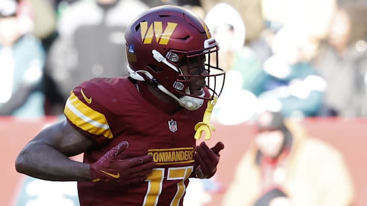 Dec 22, 2024; Landover, Maryland, USA; Washington Commanders wide receiver Terry McLaurin (17) celebrates after catching a touchdown pass against the Philadelphia Eagles during the second quarter at Northwest Stadium. Mandatory Credit: Geoff Burke-Imagn Images