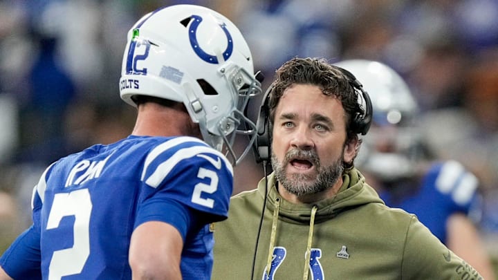 Indianapolis Colts interim head coach Jeff Saturday talks with quarterback Matt Ryan during the Colts' 17-16 loss in Week 12 to Eagles at home.