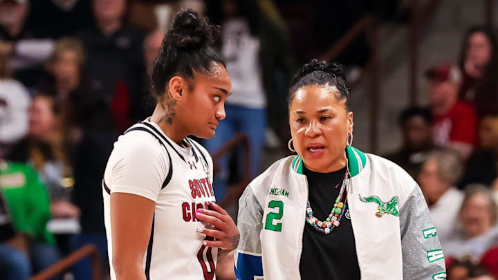 Jan 12, 2025; Columbia, South Carolina, USA; South Carolina Gamecocks head coach Dawn Staley speaks with guard Te-Hina Paopao (0) against the Texas Longhorns in the first half at Colonial Life Arena. Mandatory Credit: Jeff Blake-Imagn Images Jan 12, 2025; Columbia, South Carolina, USA; South Carolina Gamecocks head coach Dawn Staley speaks with guard Te-Hina Paopao (0) against the Texas Longhorns in the first half at Colonial Life Arena. Mandatory Credit: Jeff Blake-Imagn Images