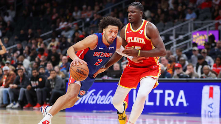Dec 18, 2023; Atlanta, Georgia, USA; Detroit Pistons guard Cade Cunningham (2) drives past Atlanta Hawks center Clint Capela (15) in the second half at State Farm Arena. Mandatory Credit: Brett Davis-Imagn Images