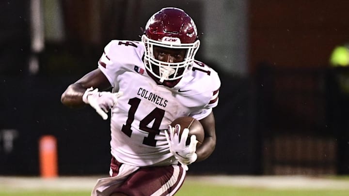Aug 31, 2024; Starkville, Mississippi, USA; Eastern Kentucky Colonels running back Brayden Latham (14) runs the ball while defended by Mississippi State Bulldogs linebacker JP Purvis (26) during the third quarter at Davis Wade Stadium at Scott Field. Mandatory Credit: Matt Bush-Imagn Images