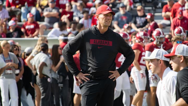 Alabama Head Coach Kalen DeBoer watches his team warm up for the game against Eastern Illinois on November 22, 2025.