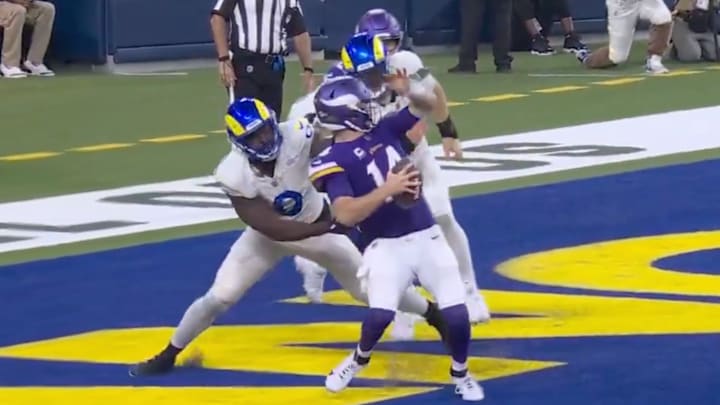 Byron Young gets away with an obvious face mask on Sam Darnold. 