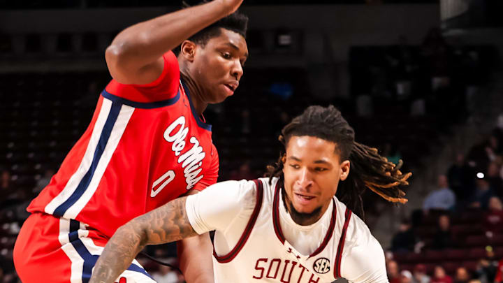 Feb 12, 2025; Columbia, South Carolina, USA; South Carolina Gamecocks guard Jamarii Thomas (6) drives around Mississippi Rebels forward Malik Dia (0) in the first half at Colonial Life Arena. Mandatory Credit: Jeff Blake-Imagn Images Feb 12, 2025; Columbia, South Carolina, USA; South Carolina Gamecocks guard Jamarii Thomas (6) drives around Mississippi Rebels forward Malik Dia (0) in the first half at Colonial Life Arena. Mandatory Credit: Jeff Blake-Imagn Images