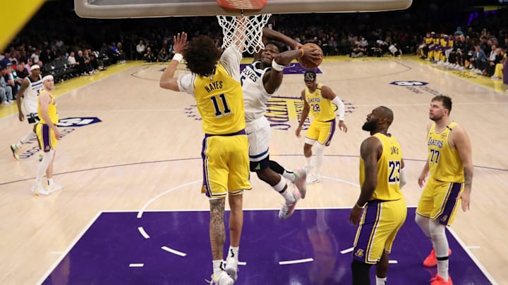Apr 22, 2025; Los Angeles, California, USA; Minnesota Timberwolves guard Anthony Edwards (5) dunks the ball against Los Angeles Lakers center Jaxson Hayes (11) during the second half of game two of first round for the 2024 NBA Playoffs at Crypto.com Arena. Mandatory Credit: Kiyoshi Mio-Imagn Images