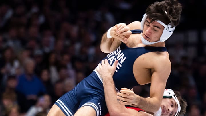 Ohio State's Nic Bouzakis takes down Penn State's Aaron Nagao in their 133-pound bout on Feb. 2, 2024, in State College, Pa. The Nittany Lions won, 28-9.