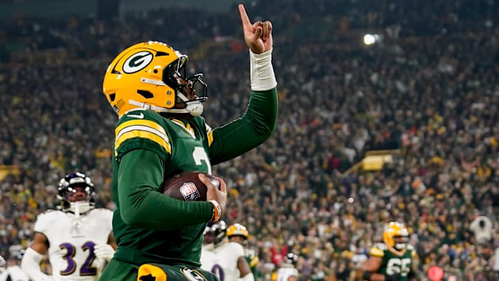 Dec 27, 2025; Green Bay, Wisconsin, USA; Green Bay Packers quarterback Malik Willis (2) celebrates after a touchdown during the second quarter against the Baltimore Ravens at Lambeau Field.