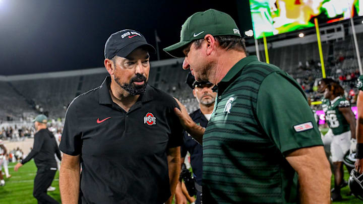 Michigan State's head coach Jonathan Smith, right, talks with Ohio State's head coach Ryan Day after the game on Saturday, Sept. 28, 2024, at Spartan Stadium in East Lansing.