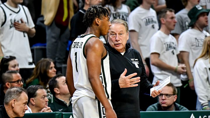 Michigan State's head coach Tom Izzo, right, talks with Jeremy Fears Jr. during the second half 