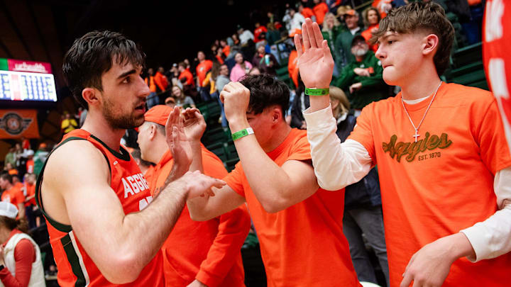 Colorado States's Ethan Morton high fives fans