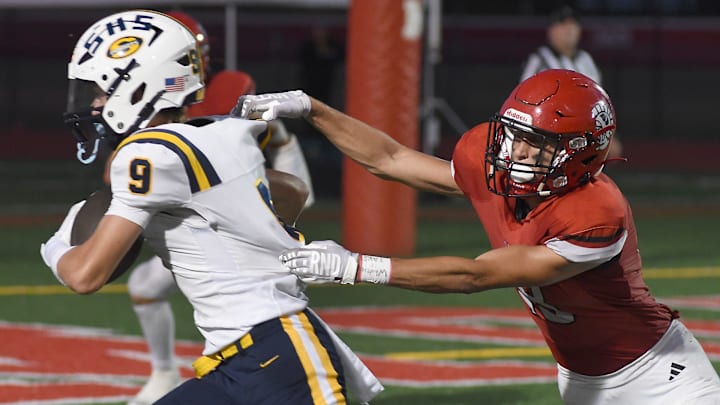 Cruz Hanson of Saline gets loose from Jacob Harvell of Monroe for a gain Friday, Sept. 20, 2024.