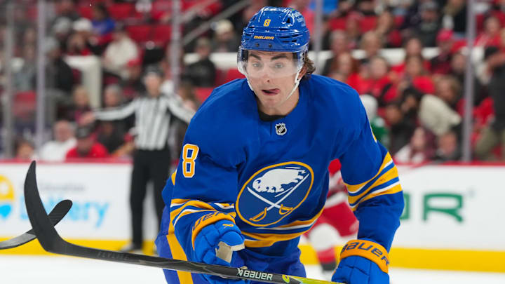 Nov 8, 2025; Raleigh, North Carolina, USA;  Buffalo Sabres defenseman Michael Kesselring (8) watches the play against the Carolina Hurricanes during the second period at Lenovo Center. Mandatory Credit: James Guillory-Imagn Images