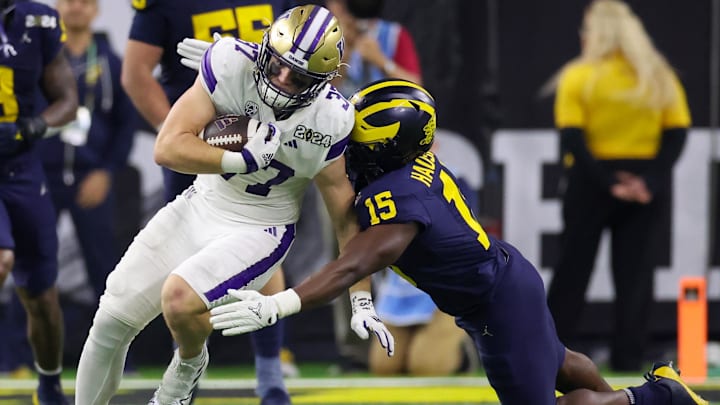 UW tight end Jack Westover is tackled by Michigan linebacker Ernest Hausmann in the 2024 CFP title game. UW tight end Jack Westover is tackled by Michigan linebacker Ernest Hausmann in the 2024 CFP title game.