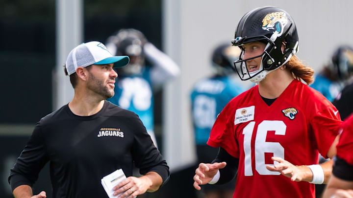 Jacksonville Jaguars quarterbacks coach Spencer Whipple, left, jogs with quarterback Trevor Lawrence (16) to the next drill during the Jacksonville Jaguars’ mandatory minicamp Tuesday June 10, 2025 at the Miller Electric Center in Jacksonville, Fla. [Doug Engle/Florida Times-Union]