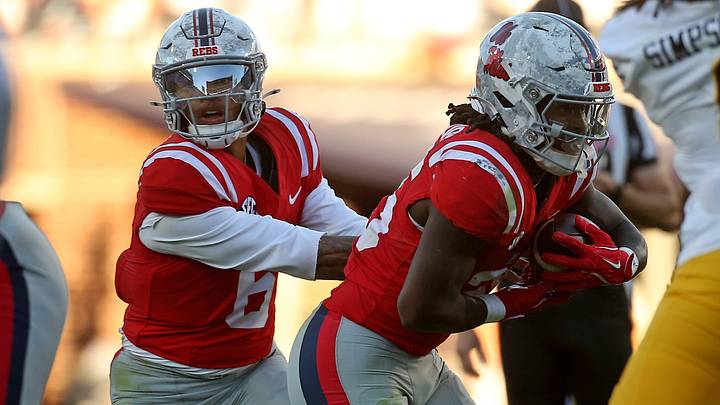 Mississippi Rebels quarterback Trinidad Chambliss hands the ball off to running back Makhi Frazier during the fourth quarter against the Missouri Tigers at Vaught-Hemingway Stadium. Mandatory Credit: Petre Thomas-Imagn Images