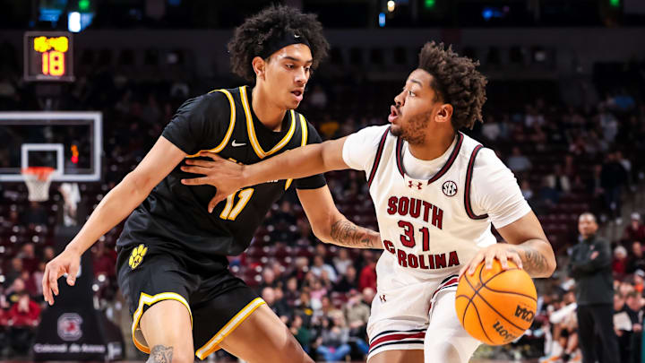 Feb 7, 2026; Columbia, South Carolina, USA; South Carolina Gamecocks forward Elijah Strong (31) attempts to drive around Missouri Tigers forward Trent Pierce (11) in the first half at Colonial Life Arena. Mandatory Credit: Jeff Blake-Imagn Images