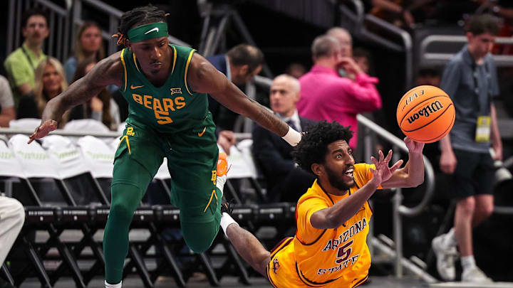 Mar 10, 2026; Kansas City, MO, USA; Arizona State Sun Devils guard Maurice Odum (5) passes against Baylor Bears guard Obi Agbim (5) during the first half at T-Mobile Center. Mandatory Credit: William Purnell-Imagn Images