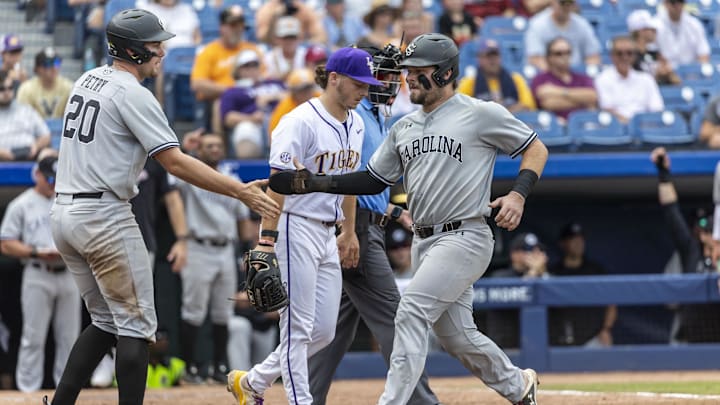 May 25, 2024; Hoover, AL, USA; South Carolina Gamecocks utility Ethan Petry (20) greets catcher Cole Messina (19) after both scored on a single by infielder Parker Noland (11) during the SEC Baseball Tournament at Hoover Metropolitan Stadium. Mandatory Credit: Vasha Hunt-Imagn Images