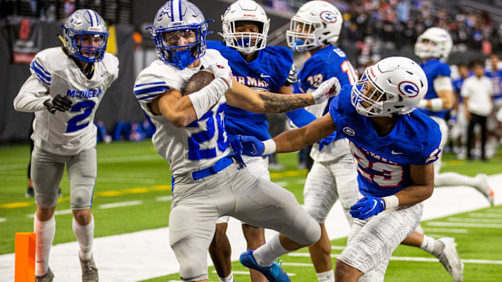McQueen running back Ashton Hayes (26) makes their only score over Bishop Gorman defensive back Isaac Ludwig (23) during the second half of their Class 5A football state championship game at Allegiant Stadium on Thursday, Nov. 18, 2021, in Las Vegas.  (L.E. Baskow/Las Vegas Review-Journal) @Left_Eye_Images

Preps 2afootball Nov19 21