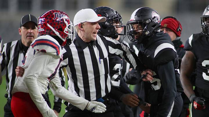 A referee steps in between Aliquippa's Marquez Coleman (85) and McKeesport's Anthony Cromerdie (12) as they exchange words during the second half of the WPIAL 4A Championship game Friday evening at Acrisure Stadium in Pittsburgh, PA. A referee steps in between Aliquippa's Marquez Coleman (85) and McKeesport's Anthony Cromerdie (12) as they exchange words during the second half of the WPIAL 4A Championship game Friday evening at Acrisure Stadium in Pittsburgh, PA.