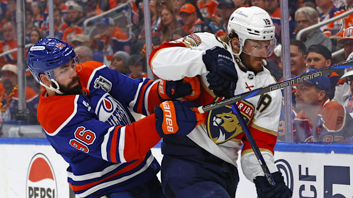 Jun 6, 2025; Edmonton, Alberta, CAN; Edmonton Oilers defenseman Jake Walman (96) checks Florida Panthers left wing Matthew Tkachuk (19) during the second period in game two of the 2025 Stanley Cup Final at Rogers Place. Mandatory Credit: Perry Nelson-Imagn Images