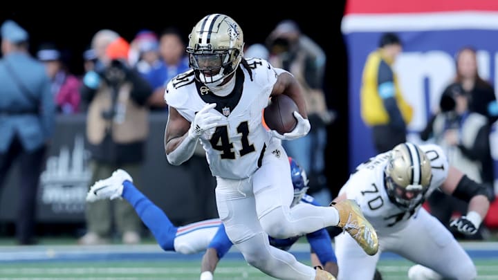 Dec 8, 2024; East Rutherford, New Jersey, USA; New Orleans Saints running back Alvin Kamara (41) runs with the ball against the New York Giants during the second quarter at MetLife Stadium. Mandatory Credit: Brad Penner-Imagn Images